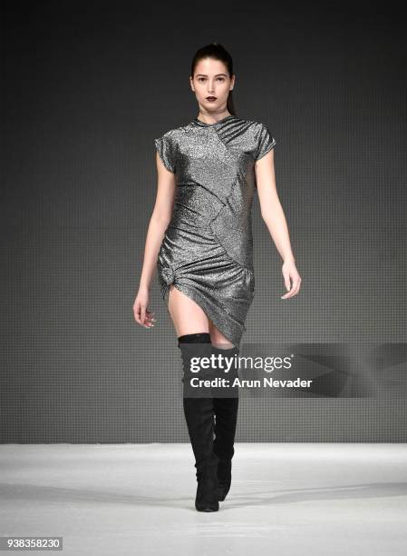 Model walks the runway wearing Wet Ink at 2018 Vancouver Fashion Week - Day 4 on March 22, 2018 in Vancouver, Canada.