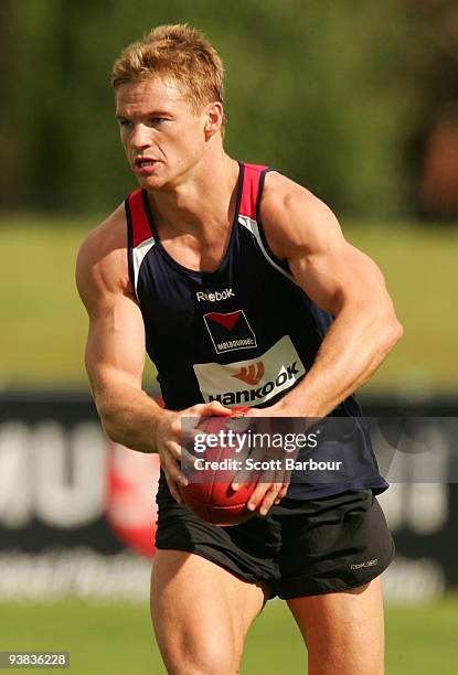 Colin Sylvia of the Demons runs with the ball during a Melbourne Demons AFL training session at Casey Fields on December 4, 2009 in Melbourne,...