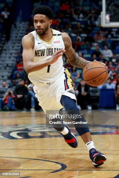Larry Drew II of the New Orleans Pelicans dribbles the ball down court during the first half of a NBA game against the Dallas Mavericks at the...