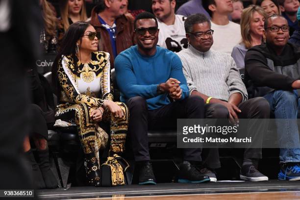 Taraji P. Henson and Lyriq Bent attend the game between the Cleveland Cavaliers and the Brooklyn Nets at Barclays Center on March 25, 2018 in the...