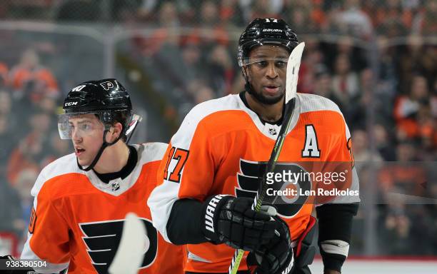 Wayne Simmonds and Jordan Weal of the Philadelphia Flyers look on prior to the start of play against the Washington Capitals on March 18, 2018 at the...