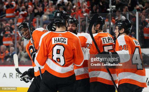 Robert Hagg, Radko Gudas, Valitteri Filppula and Jordan Weal of the Philadelphia Flyers react following Wayne Simmonds third period goal against the...