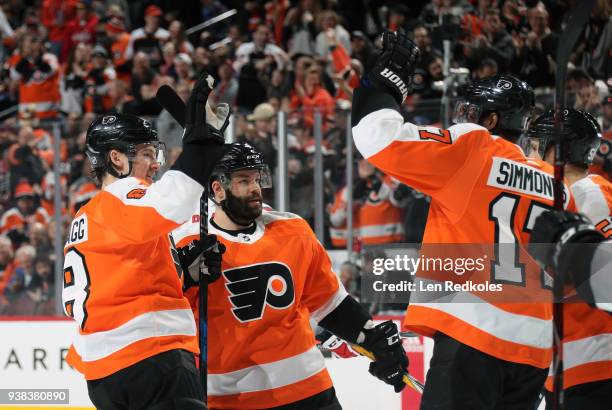 Robert Hagg, Radko Gudas and Valitteri Filppula of the Philadelphia Flyers celebrate with teammate Wayne Simmonds following his third period goal...