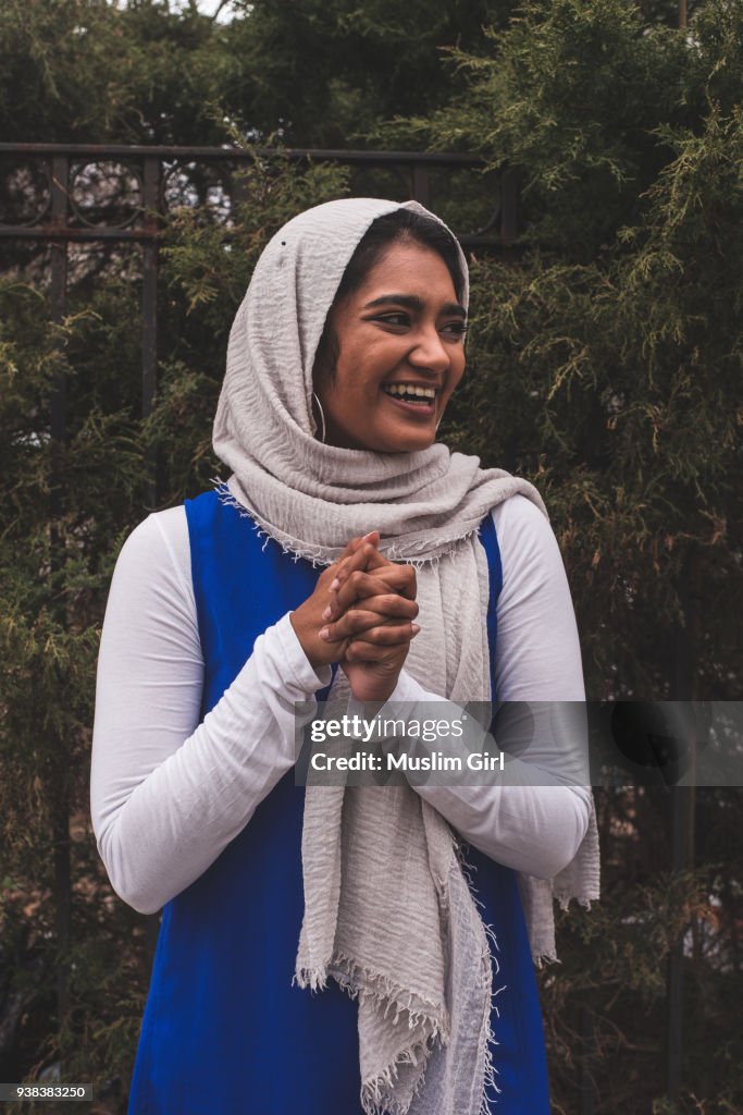 A Super Happy Muslim Girl in The Garden, Looking Away