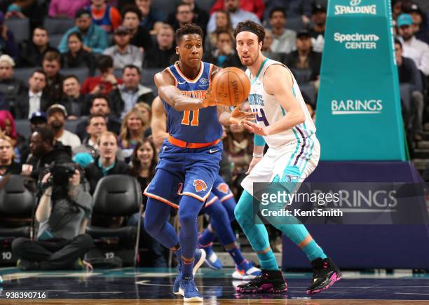Frank Ntilikina of the New York Knicks ;pt. ; against Frank Kaminsky of the Charlotte Hornets on March 26, 2018 at Spectrum Center in Charlotte,...