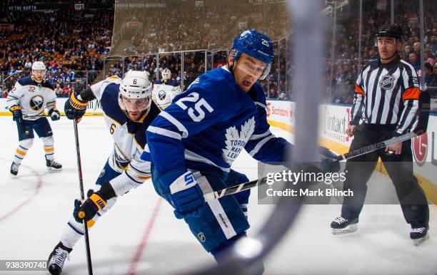 James van Riemsdyk of the Toronto Maple Leafs skates against Marco Scandella of the Buffalo Sabres during the first period at the Air Canada Centre...