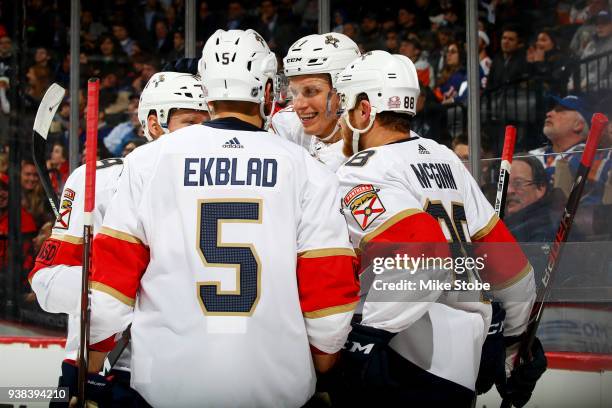 Nick Bjugstad of the Florida Panthers celebrates his second-period power play goal against the New York Islanders with teammates Aaron Ekblad, Jamie...