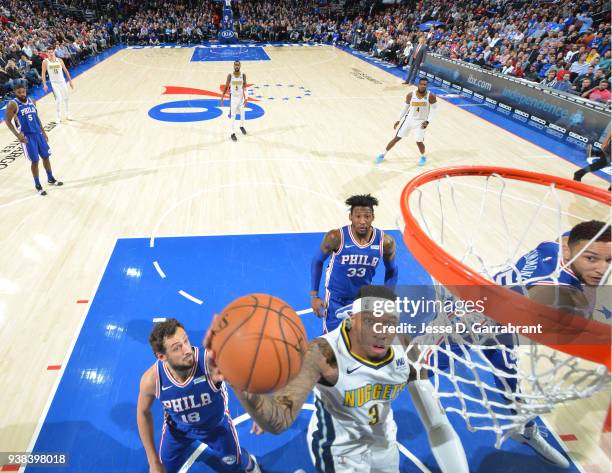 Torrey Craig of the Denver Nuggets goes up for the layup against the Philadelphia 76ers at Wells Fargo Center on March 26, 2018 in Philadelphia,...