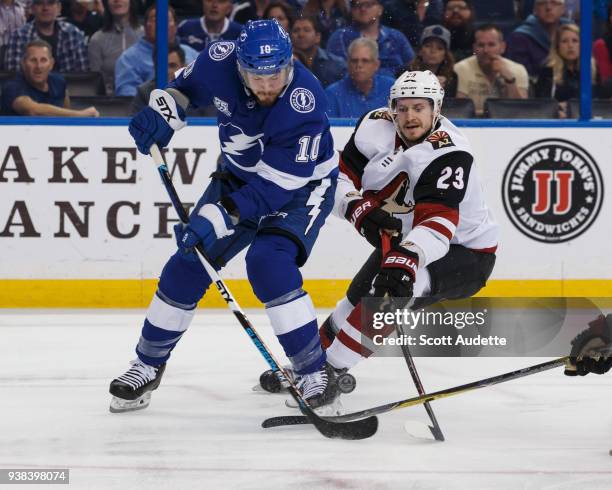 Miller of the Tampa Bay Lightning skates against Oliver Ekman-Larsson of the Arizona Coyotes during first period at Amalie Arena on March 26, 2018 in...