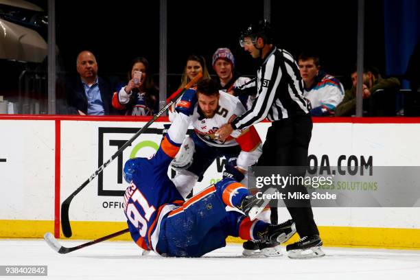 Aaron Ekblad of the Florida Panthers and John Tavares of the New York Islanders mix it up during the second period at Barclays Center on March 26,...