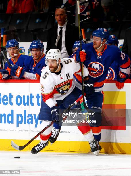 Aaron Ekblad of the Florida Panthers emerges with the puck following a puck battle with Chris Wagner of the New York Islanders during the second...