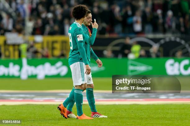 Mesut Oezil of Germany speak with Leroy Sane of Germany during the international friendly match between Germany and Spain at Esprit-Arena on March...