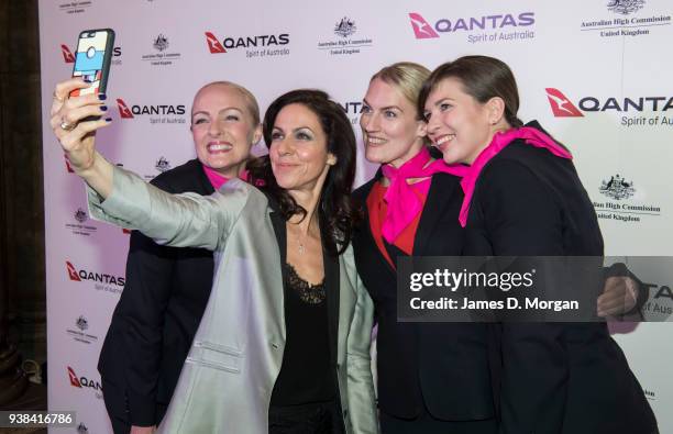 Julia Bradbury takes a selfie with Qantas cabin crew as they arrive at Australia House for a celebration party for Qantas on March 26, 2018 in...