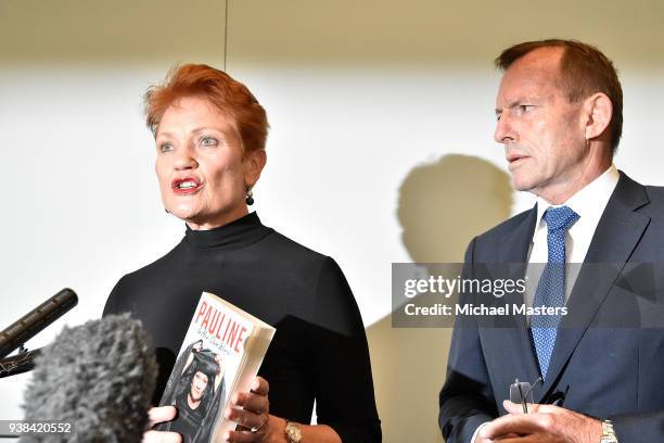 Pauline Hanson makes some remarks while standing next to Tony Abbott stand together during the launch of 'Pauline, In Her Own Words' on March 27,...