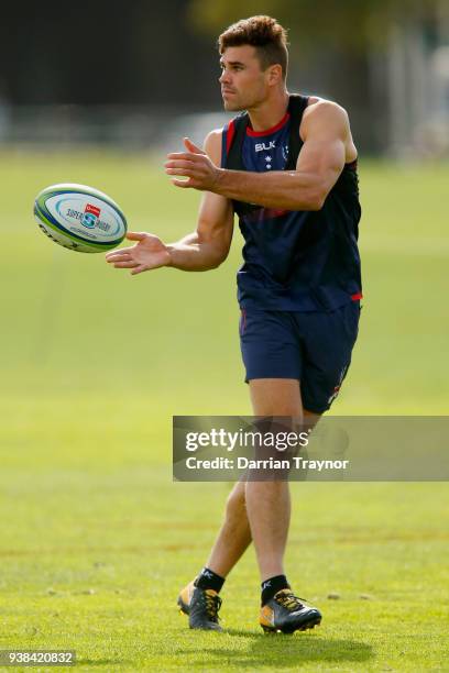 Tom English passes the ball during a Melbourne Rebels Super Rugby training session at Goschs Paddock on March 27, 2018 in Melbourne, Australia.