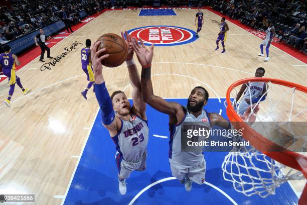 Blake Griffin and Andre Drummond of the Detroit Pistons reach for the rebound during the game against the Los Angeles Lakers on March 26, 2018 at...