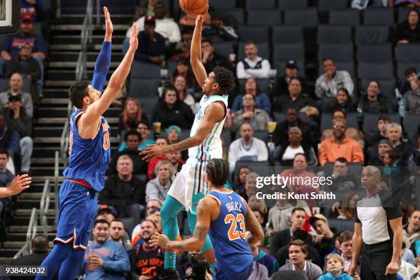 Malik Monk of the Charlotte Hornets shoots the ball against Enes Kanter of the New York Knicks on March 26, 2018 at Spectrum Center in Charlotte,...