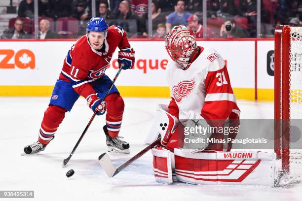 Goaltender Jared Coreau of the Detroit Red Wings allows a rebound near Brendan Gallagher of the Montreal Canadiens during the NHL game at the Bell...
