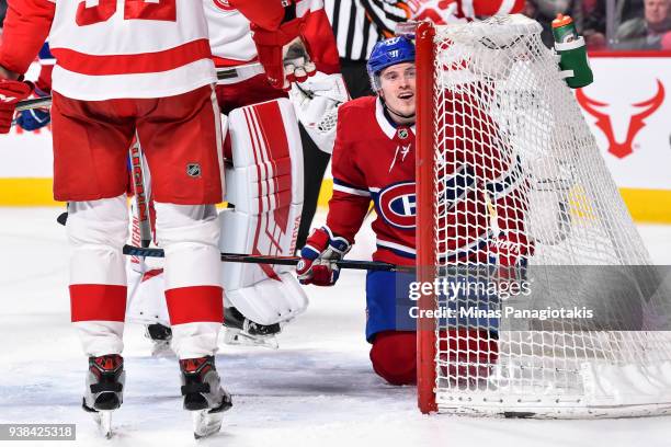 Brendan Gallagher of the Montreal Canadiens falls inside the net against the Detroit Red Wings during the NHL game at the Bell Centre on March 26,...