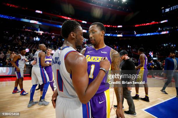 Reggie Jackson of the Detroit Pistons and Kentavious Caldwell-Pope of the Los Angeles Lakers exchange a hug after the game between the two teams on...