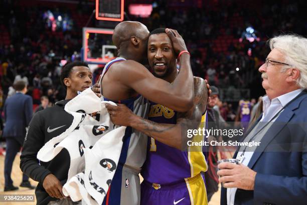 Anthony Tolliver of the Detroit Pistons and Kentavious Caldwell-Pope of the Los Angeles Lakers hug after the game on March 26, 2018 at Little Caesars...