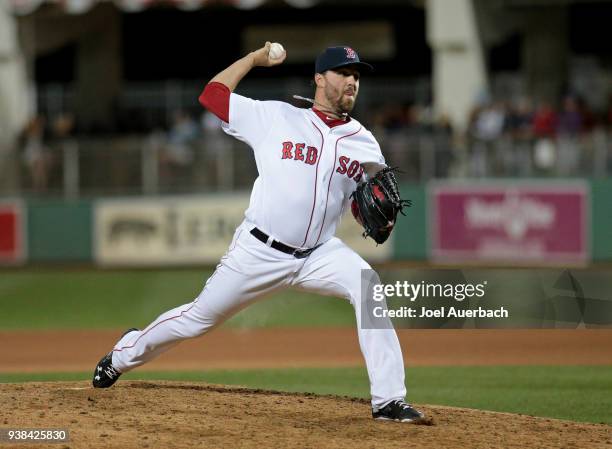 Heath Hembree of the Boston Red Sox throws the ball against the Chicago Cubs during the seventh inning of a spring training game at JetBlue Park on...