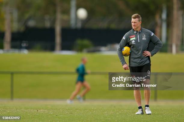Nathan Buckley, Senior Coach of the Magpies looks on during a Collingwood Magpies AFL training session at Holden Centre on March 27, 2018 in...
