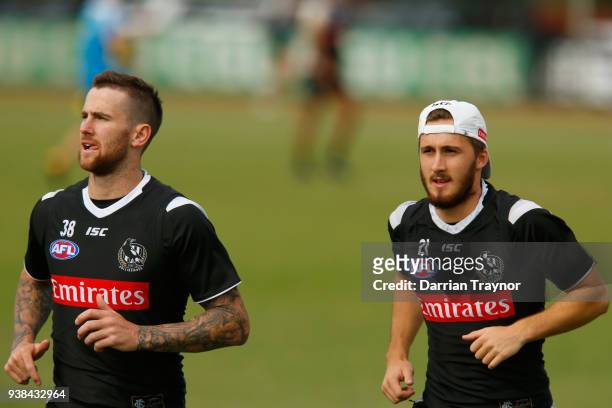 Jeremy Howe and Tim Broomhead jog during a Collingwood Magpies AFL training session at Holden Centre on March 27, 2018 in Melbourne, Australia.