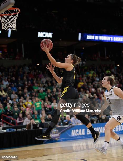 Lexi Bando of the Oregon Ducks goes to the basket against Marina Mabrey of the Notre Dame Fighting Irish during the 2018 NCAA Division 1 Women's...