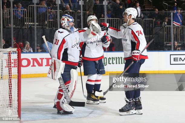 Philip Grubauer and John Carlson of the Washington Capitals celebrate after defeating the New York Rangers 4-2 at Madison Square Garden on March 26,...