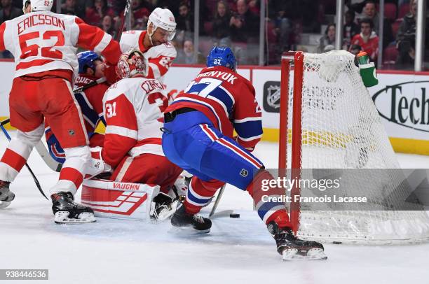 Alex Galchenyuk of the Montreal Canadiens scores a goal on goaltender Jared Coreau of the Detroit Red Wings in the NHL game at the Bell Centre on...