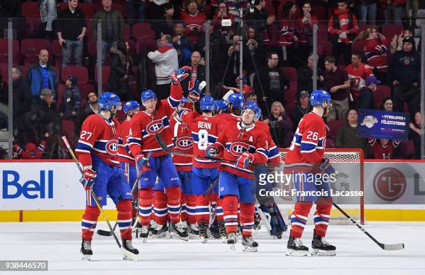Montreal Canadiens' players celebrate after defeating the Detroit Red Wings in the NHL game at the Bell Centre on March 26, 2018 in Montreal, Quebec,...