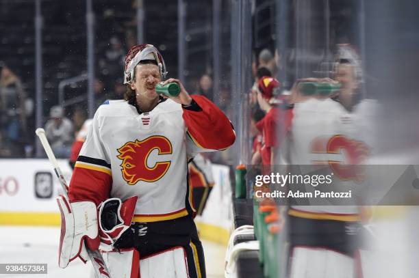 Mike Smith of the Calgary Flames takes a water break before a game against the Los Angeles Kings at STAPLES Center on March 26, 2018 in Los Angeles,...