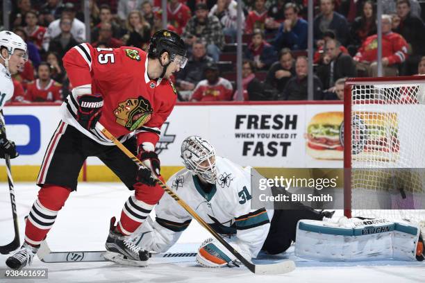 Goalie Martin Jones of the San Jose Sharks blocks the shot against Artem Anisimov of the Chicago Blackhawks in the third period at the United Center...