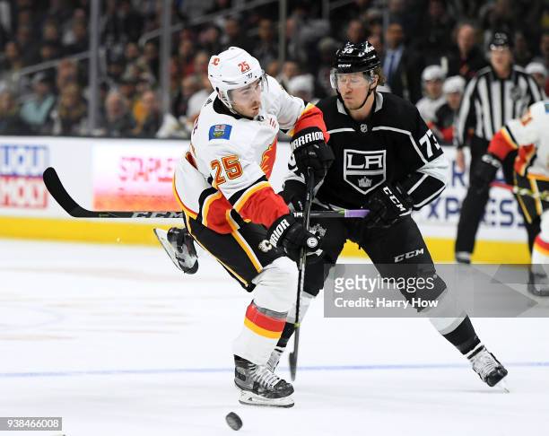 Nick Shore of the Calgary Flames takes a shot in front of Tyler Toffoli of the Los Angeles Kings during the first period at Staples Center on March...