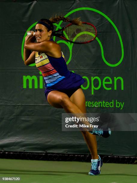 Monica Puig of Puerto Rico hits a backhand to Danielle Collins of the USA on Day 8 of the Miami Open Presented by Itau at Crandon Park Tennis Center...