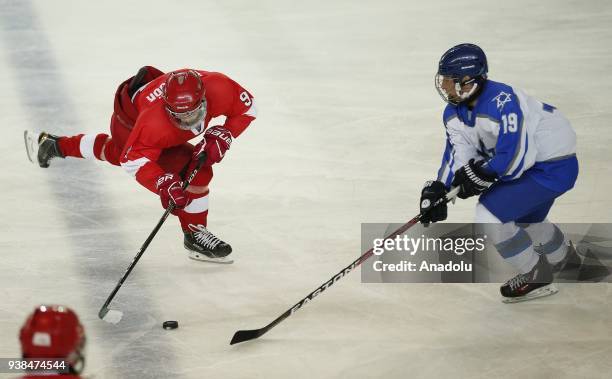 Omer Gungor of Turkey vies with Gal Tamir of Israel during the 2018 IIHF Ice Hockey U18 World Championship Division III Group A match between Turkey...