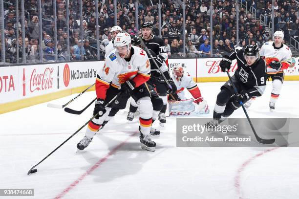 Travis Hamonic of the Calgary Flames handles the puck during a game against the Los Angeles Kings at STAPLES Center on March 26, 2018 in Los Angeles,...