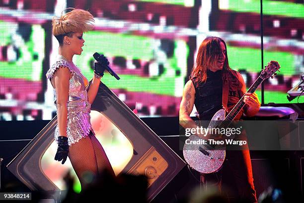 Singer Rihanna performs onstage with musician Nuno Bettencourt in concert presented by MySpace and JetBlue at Hammerstein Ballroom on December 3,...