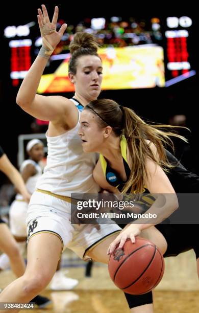 Sabrina Ionescu of the Oregon Ducks drives against Marina Mabrey of the Notre Dame Fighting Irish during the 2018 NCAA Division 1 Women's Basketball...