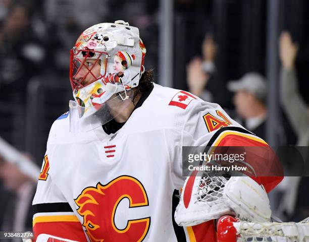 Mike Smith of the Calgary Flames reacts to a goal from Dion Phaneuf of the Los Angeles Kings for a 1-0 lead during the second period at Staples...