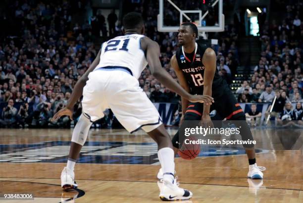 Texas Tech guard Keenan Evans watched by Villanova forward Dhamir Cosby-Roundtree during an Elite Eight matchup between the Villanova Wildcats and...