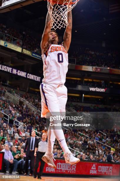 Marquese Chriss of the Phoenix Suns dunks against the Boston Celtics on March 26, 2018 at Talking Stick Resort Arena in Phoenix, Arizona. NOTE TO...