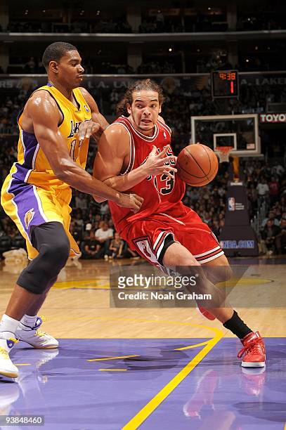 Joakim Noah of the Chicago Bulls drives to the basket against Andrew Bynum 17 of the Los Angeles Lakers during the game at Staples Center on November...