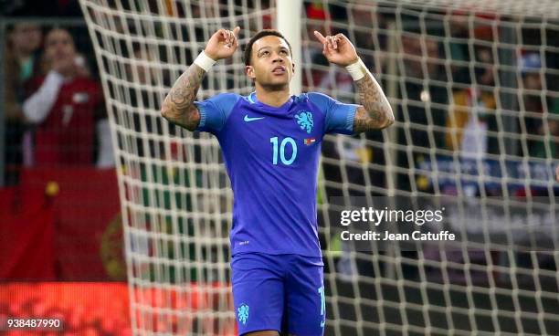 Memphis Depay of the Netherlands celebrates his goal during the international friendly match between Portugal and the Netherlands at Stade de Geneve...