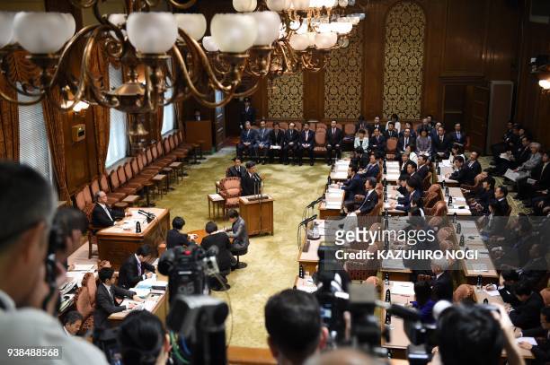 Nobuhisa Sagawa , former senior Finance Ministry official, attends an Upper House budget committee meeting to give a testimony in parliament in Tokyo...