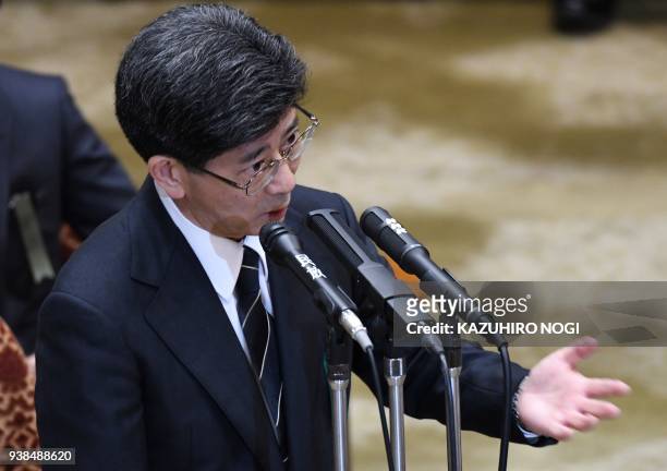 Nobuhisa Sagawa, former senior Finance Ministry official, gestures as he attends an Upper House budget committee meeting to give a testimony in...
