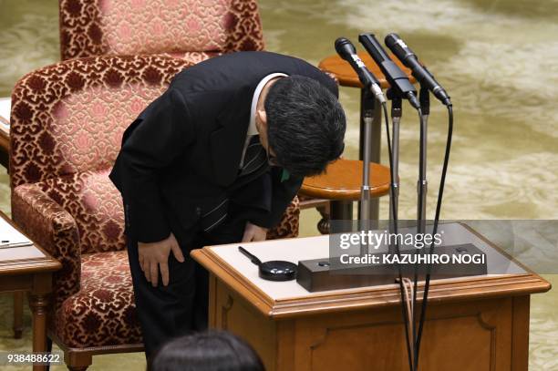 Nobuhisa Sagawa, former senior Finance Ministry official, bows as he attends an Upper House budget committee meeting to give a testimony in...