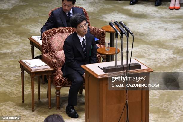 Nobuhisa Sagawa , former senior Finance Ministry official, listens to questions as he attends an Upper House budget committee meeting to give a...