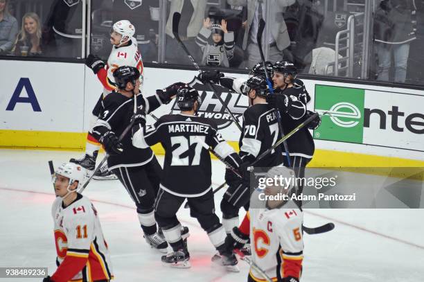 Dion Phaneuf, Alec Martinez, Tanner Pearson, Adrian Kempe, and Kyle Clifford of the Los Angeles Kings celebrate after scoring a goal against the...